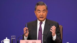 China's foreign minister accuses US of devising tactics to suppress China